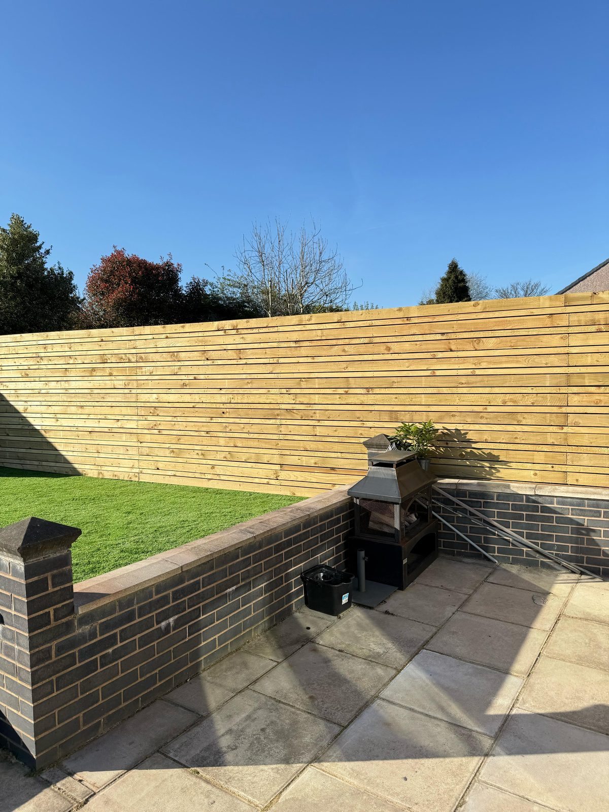 Horizontal slatted garden fence
